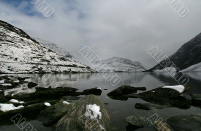 snow mountain with cold lake