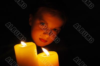 young girl in candlelight