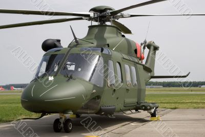 A dark green helicopter
