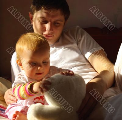 Father play with little daughter