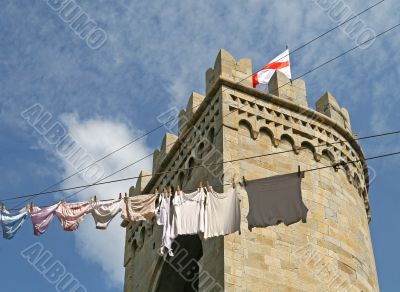 Genoa: clothesline in front of historic tower