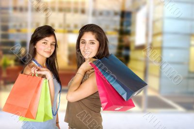 beautiful teenagers with shopping bags