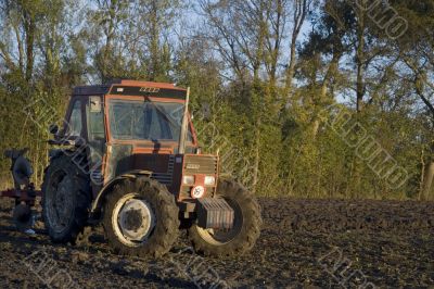 tractor in cultivated field