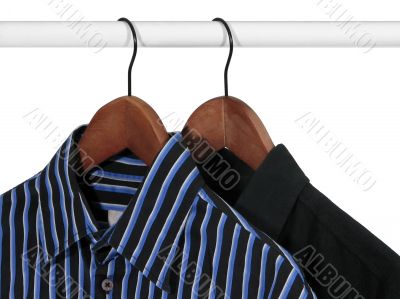 Black and blue shirts on a rack