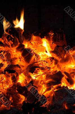 Glowing coals in the fireplace