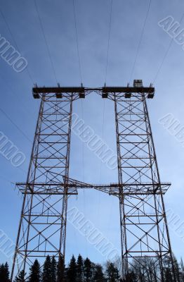 Big double electricity pylon in the forest
