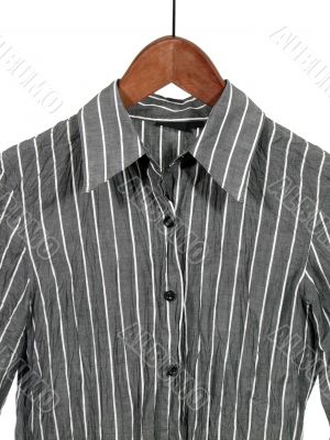 Gray striped shirt on wooden hanger