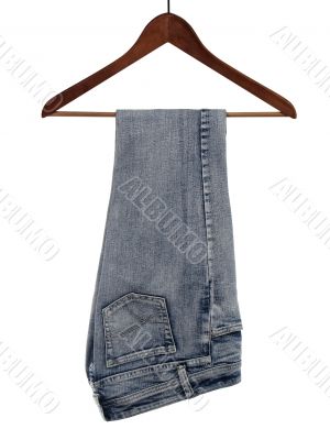 Jeans on wooden hanger