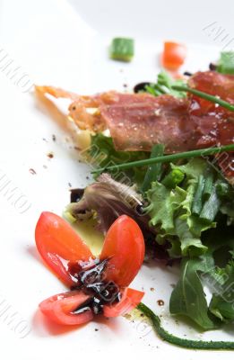 Season salad with crispy parma ham