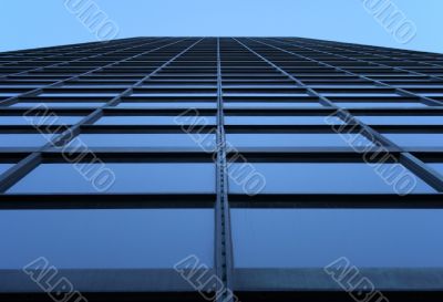 Glass-windowed skyscraper reaching the sky