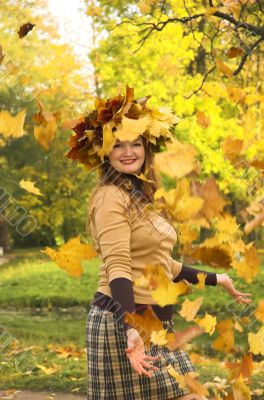 The cheerful girl on rest in autumn park