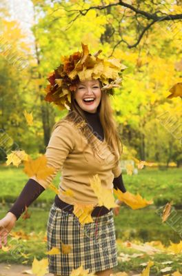 The cheerful girl on rest in autumn park
