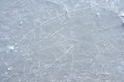 Skate marks on the surface of an outdoor ice rink