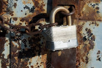 Iron lock and rusty chain