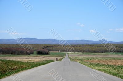 Country road leading to mountains