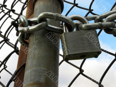 Lock, chains and chain link fence