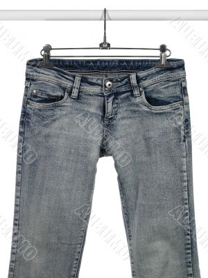 Blue jeans on a closet rod