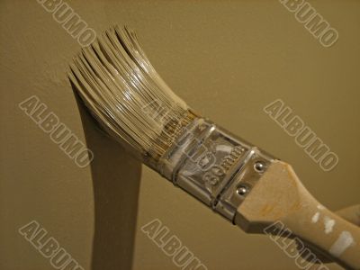 Paint brush painting a wall Paint brush painting a wall
