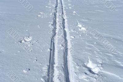 Ski track crossing a winter terrain