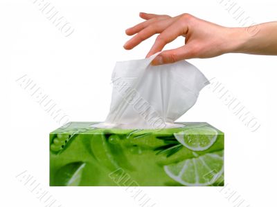 Female hand taking a tissue from a box