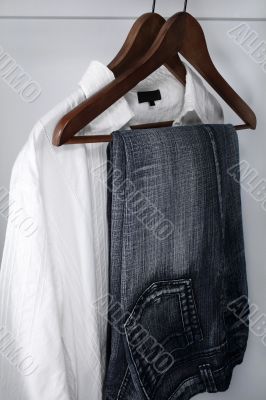 Man`s clothing - blue jeans and white shirt