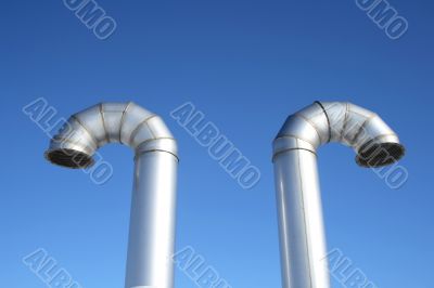 Two shiny metal ventilation pipes Two shiny metal ventilation pipes