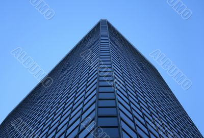 Angle view of a glass-windowed office tower Angle view of a glass-windowed office tower