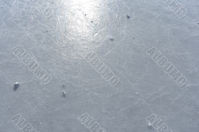 Sun reflecting in the surface of an ice rink