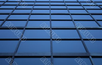 Blue glass panels of a skyscraper