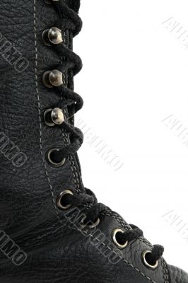 Closeup of black leather boot