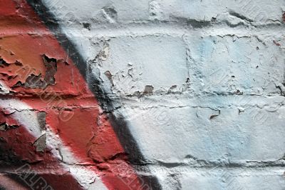 Graffiti on a peeling brick wall Graffiti on a peeling brick wall
