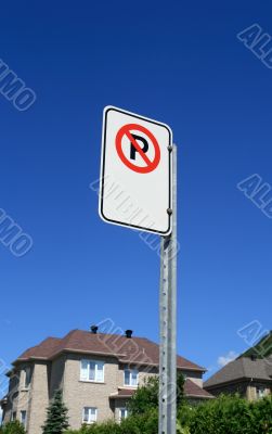 No parking sign in front of a new house
