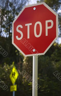 Signs Stop and School together