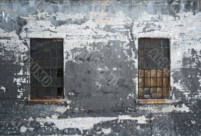 Grungy wall with two windows