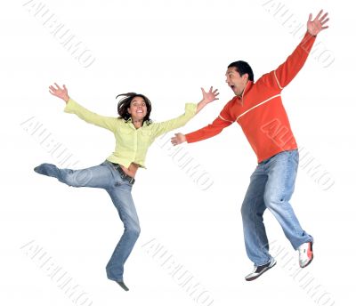 happy casual couple jumping up