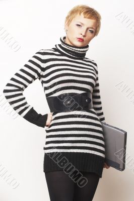 Nice blondgirl standing with laptop