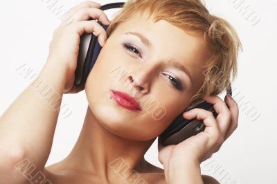 Close up portrait of young and attractive party girl with headph