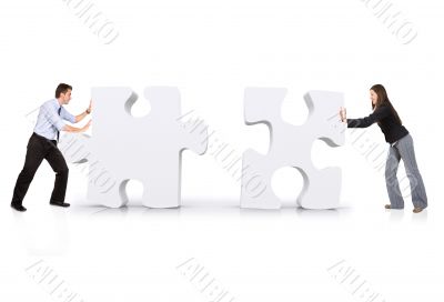 business partners putting puzzle together