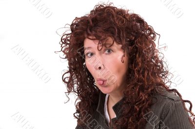 Sticking out her tongue