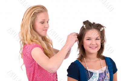 Doing her hair Doing her hair