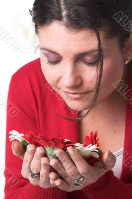 Beautiful woman smelling the flowers Beautiful woman smelling the flowers