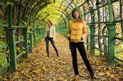 Two girls having a rest in autumn park