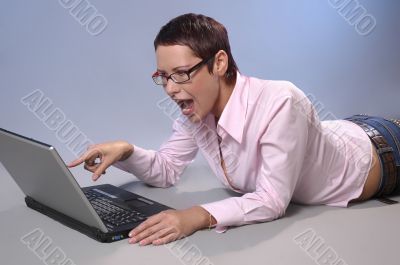 The shouting business woman with a computer