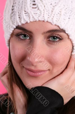 Girl in wool hat on pink background Girl in wool hat on pink background