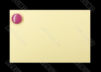 Pushpin on a yellow note Pushpin on a yellow note