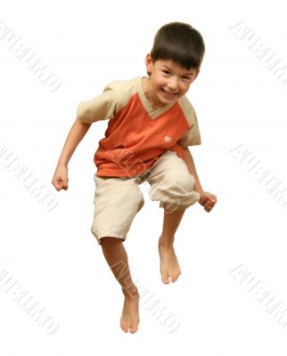 Boy jumps on white background.