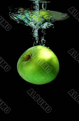 Apple falling into water