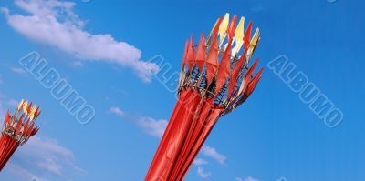 many red flags on blue sky