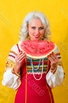 Girl in a national suit with big berry