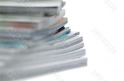 Stack of magazines on white